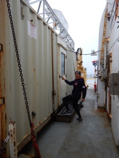 Getting supplies from one of the containers, or vans, on deck.